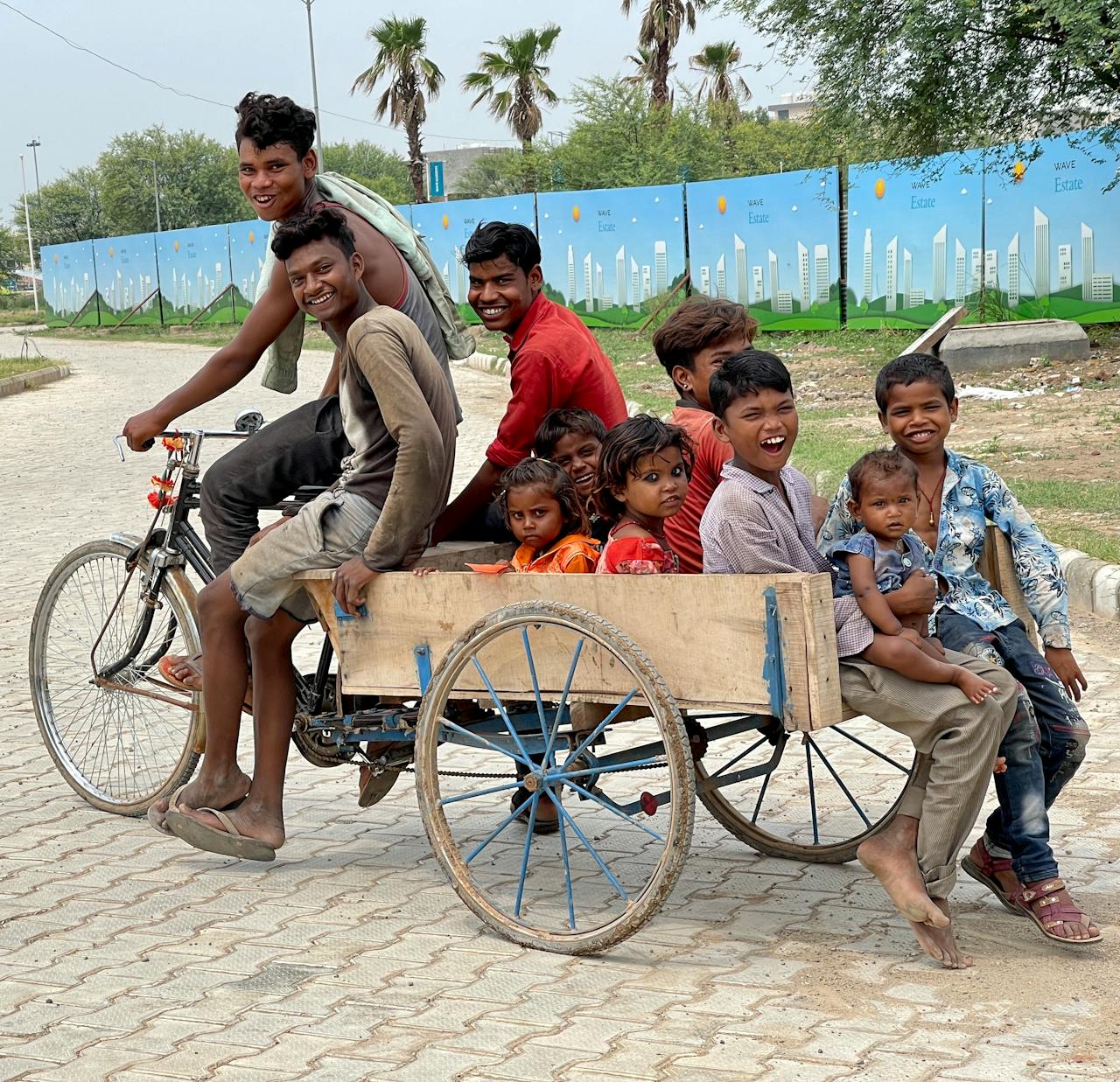 Kids Riding a Bicycle Cart